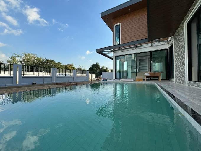 Private pool beside a two-storey villa at Aqua Pool Villas