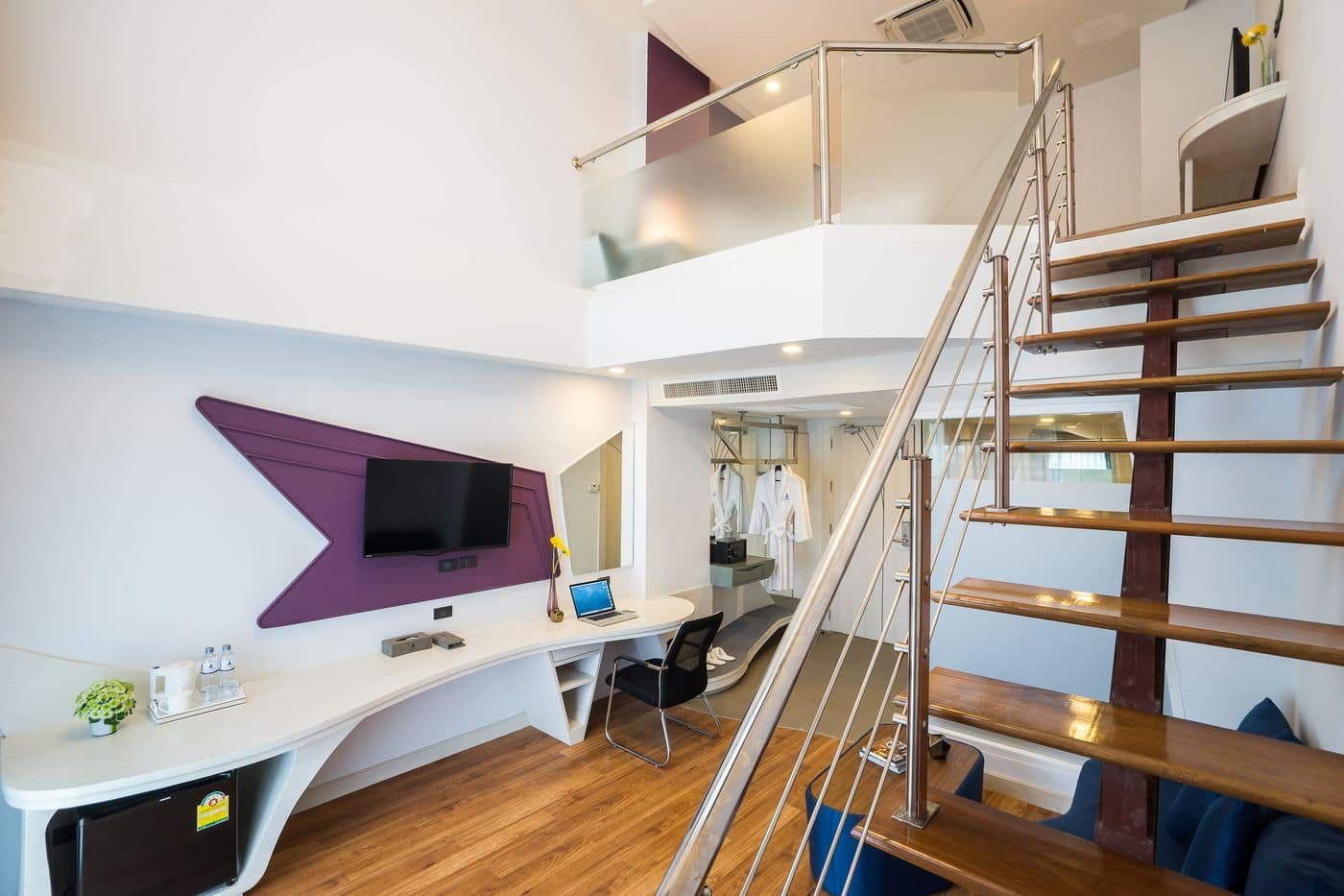 Duplex room with a staircase up to the loft level at Blue Boat, Pattaya