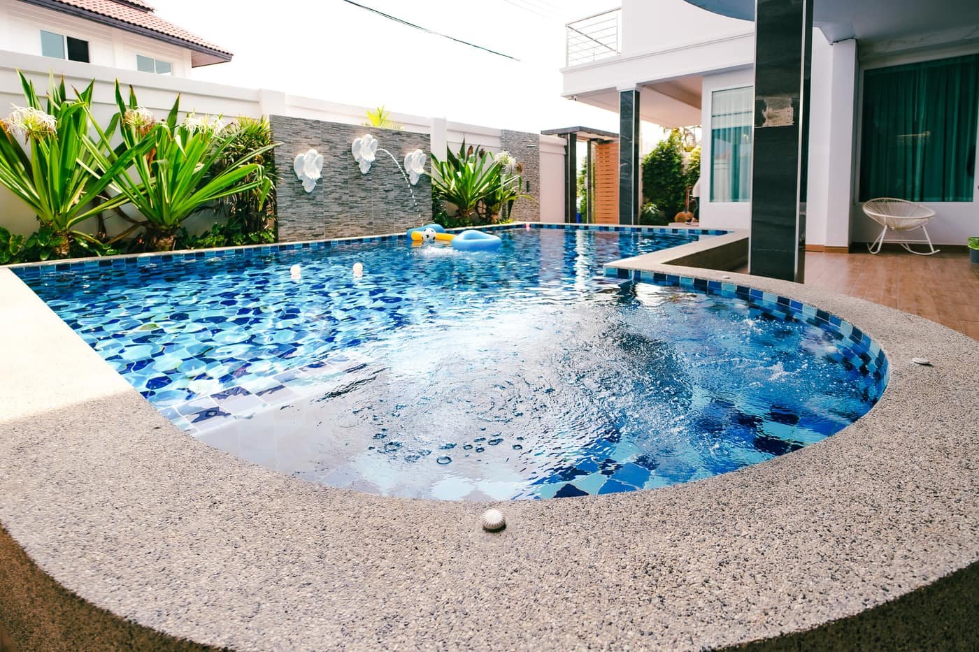 Private pool with blue mosaic tiles at Tag Villas