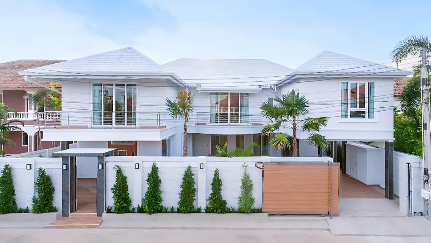 Row of white villa exteriors at Tag Villas, Pattaya